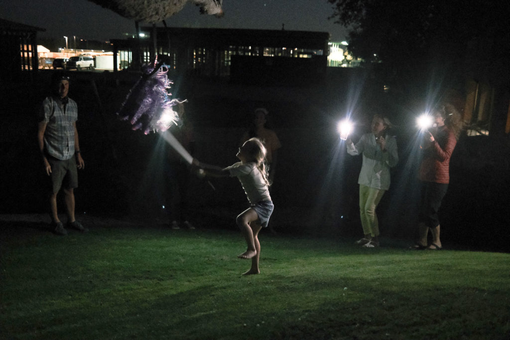 Sierra Dispenza swings at a birthday celebration pinata in Tucson
